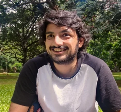 Photo of Tanay smiling outdoors